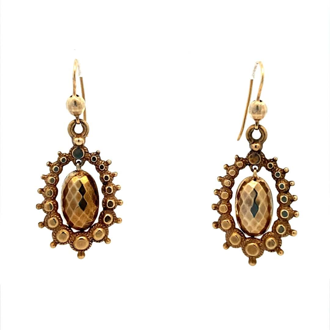 A pair of estate 9 karat yellow gold antique Victorian drop earrings.