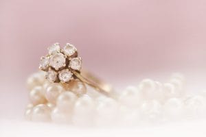 Getting Jewelry Appraised with Diamond Engagement Ring and Pearl Necklace
