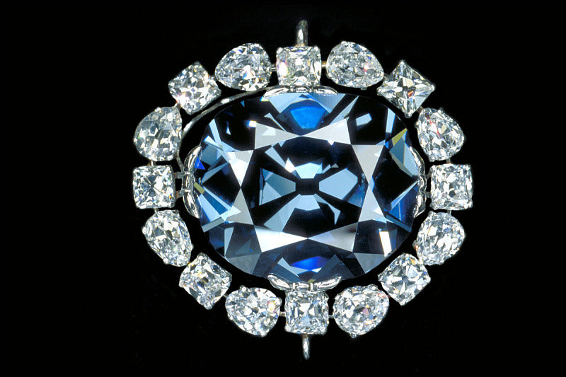 The Hope Diamond with a diamond halo and a black background