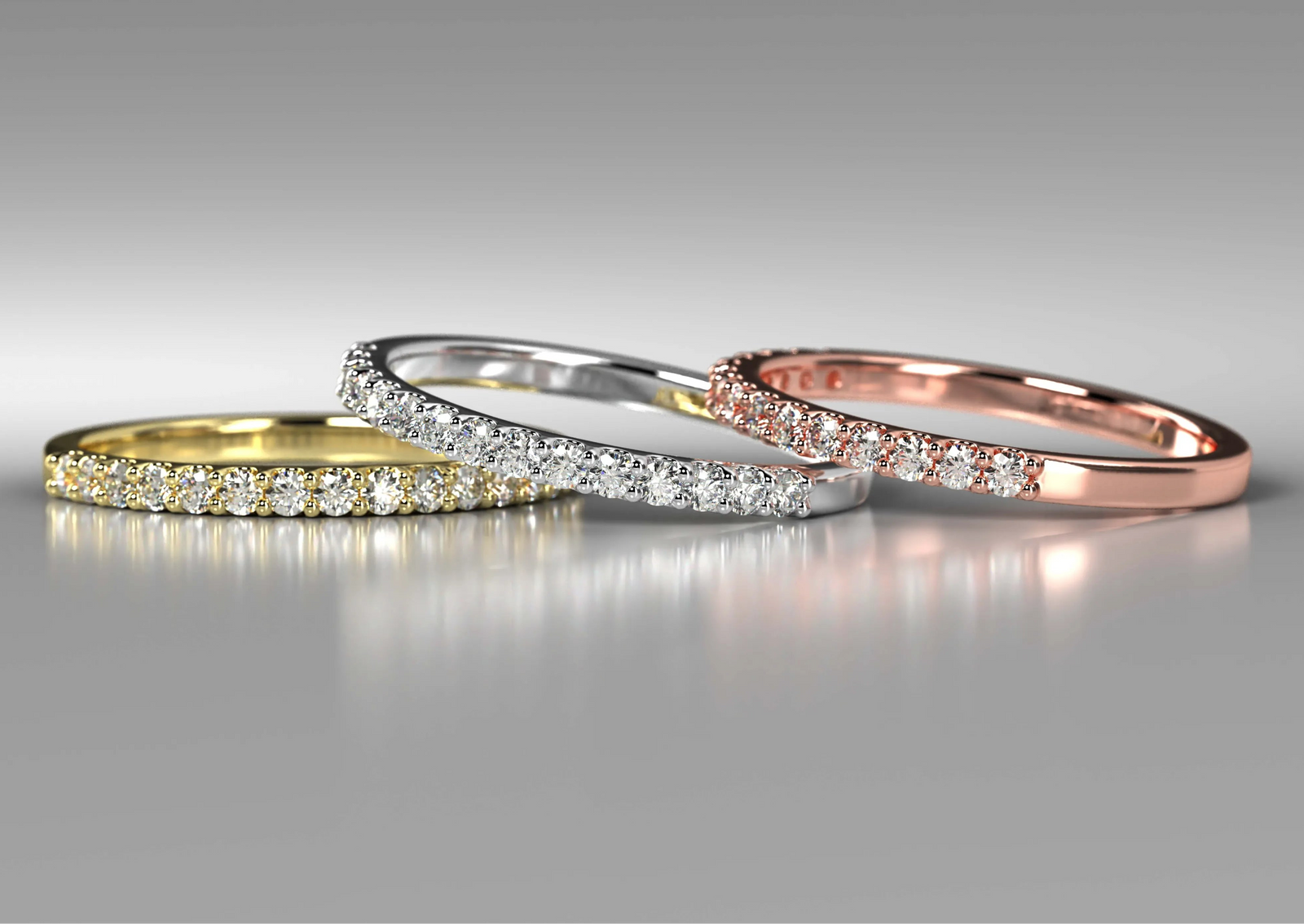 Diamond wedding bands in different metal colors including yellow gold, white gold, and rose gold