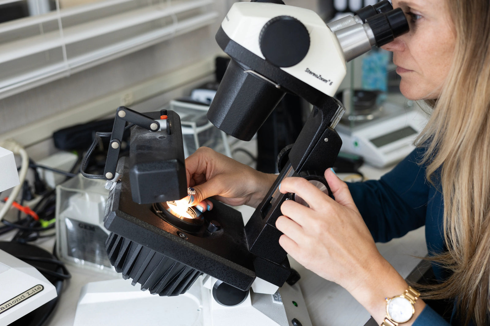 A professional jewelry appraiser looks into a 