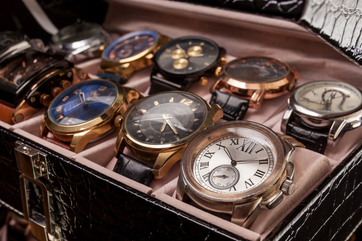 Collection of luxury watches in a display case.