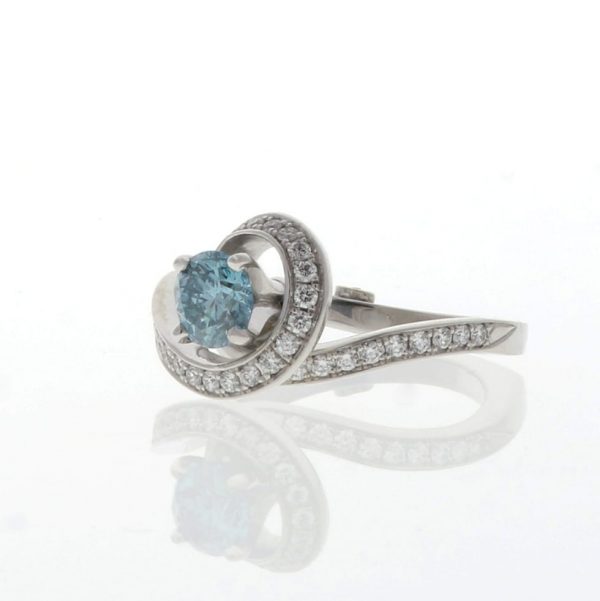 bewitched engagement ring by Mark Schneider with blue diamond