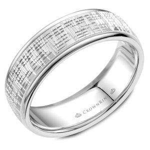 A 14 karat white gold men's wedding band with a carved texture center resembling a heartbeat or audio track visual