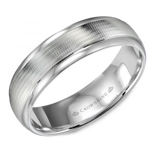 A 14 karat white gold men's wedding band featuring a textured center and polished edges