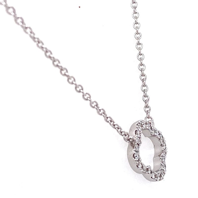 One 18 karat white gold diamond clover necklace by Hearts On Fire containing 0.12 carats of round brilliant diamonds. The pendant is fixed on an adjustable 18" chain.