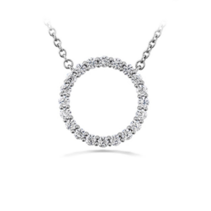 One 18 karat white gold open circle diamond necklace with 0.36 carats of round brilliant diamonds. the pendant is fixed on chain adjustable in length from 16 - 18". By Hearts On Fire.
