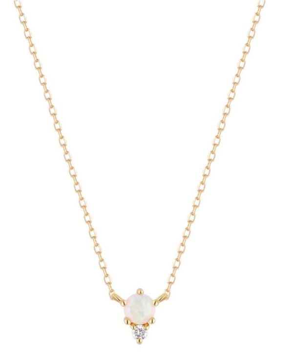 One 14 karat yellow gold necklace by Aurelie Gi with a fixed pendant set with a round cabochon opal and a round-faceted accent diamond. The necklace is adjustable in length and can be worn at 16" or 18"