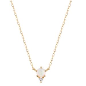 One 14 karat yellow gold necklace by Aurelie Gi with a fixed pendant set with a round cabochon opal and a round-faceted accent diamond. The necklace is adjustable in length and can be worn at 16" or 18"