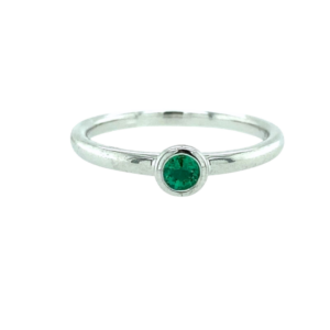 One sterling silver emerald solitaire ring containing a 3mm round emerald in a bezel setting.