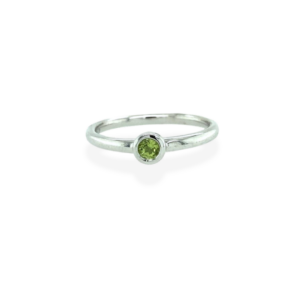 One sterling silver peridot ring with a 3mm round peridot in a bezel setting.