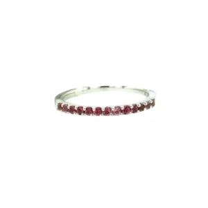 A 14 karat white gold petite band with round-faceted rubies