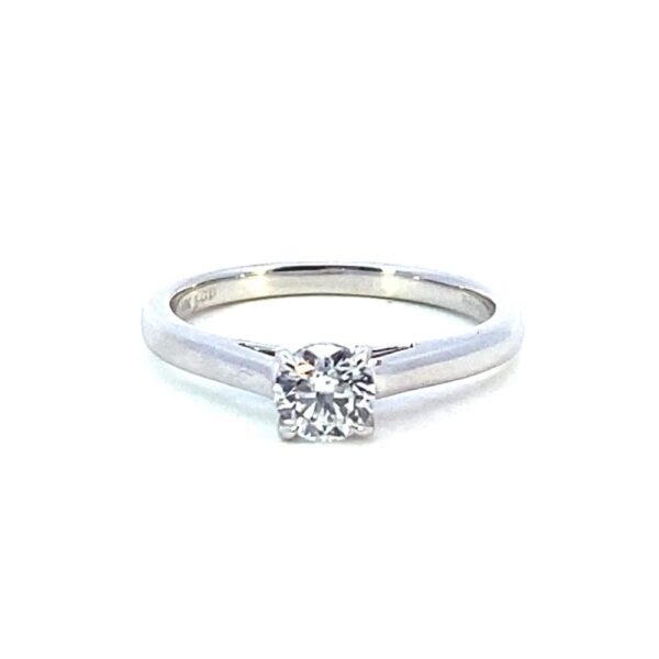 One 14 karat white gold diamond solitaire engagement ring with a lab-grown round brilliant diamond weighing 0.50 carat in a cathedral setting