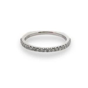 One 14 karat white gold classic wedding band containing 21 round brilliant-cut diamonds weighing 0.26 carat total weight in pave settings. The band has a Euro-shank design
