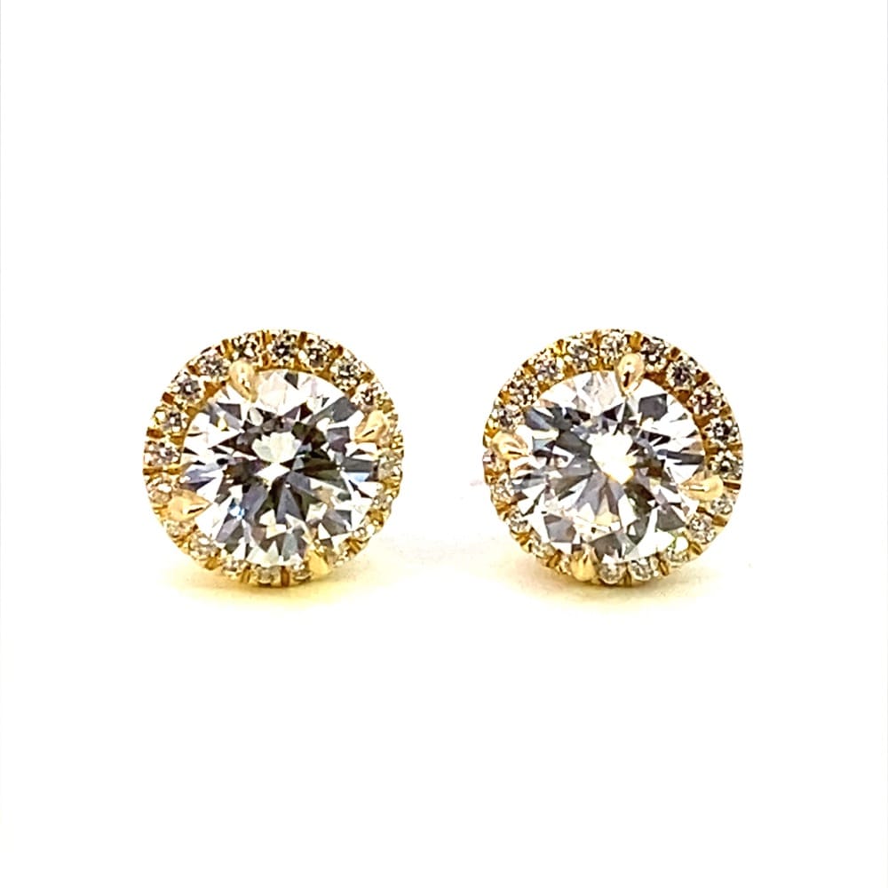 One pair of 14 karat yellow gold stud earrings with 3.30 carats of lab-grown round brilliant diamonds in a halo design