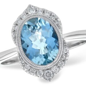 One 14 karat white gold ring with a center oval shaped faceted aquamarine weighing 1.56 carats in a bezel setting with two slender milgrain halos and a vintage-inspired pointed diamond halo with 18 round brilliant diamonds