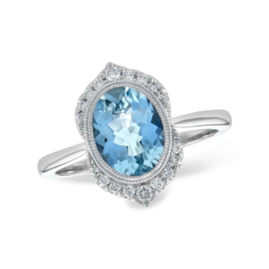 One 14 karat white gold ring with a center oval shaped faceted aquamarine weighing 1.56 carats in a bezel setting with two slender milgrain halos and a vintage-inspired pointed diamond halo with 18 round brilliant diamonds
