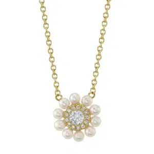One 14 karat yellow gold pearl and diamond circle necklace by Shy Creation containing a center round brilliant diamond weighing 0.09 carat surrounded by a round diamond halo with the outside of the pendant accented by 2.1-.23mm cultured pearls. The pendant is fixed on a cable chain