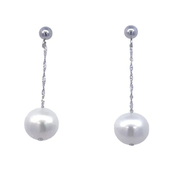 A pair of 14 karat white gold dangle drop earrings with freshwater pearl drops on rope chains