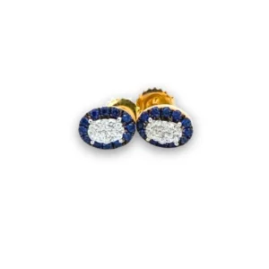 One pair of 14 karat two-tone gold stud earrings each featuring an oval-shaped center cluster of round diamonds weighing 0.30 carat total weight in white gold pave settings and surrounded by a halo of round blue sapphires weighing 0.48 carat total weight in black rhodium-plated settings. The earring frames, posts, and backs are crafted from 14 karat yellow gold.