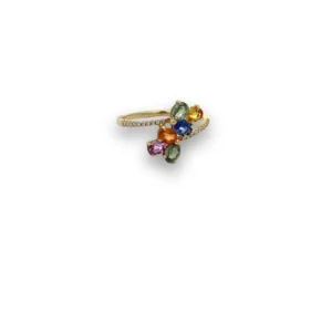 One 14 karat yellow gold ring containing 4 oval sapphires measuring 4x3mm each and weighing 1.40 carat total weight in a variety of color including green, orange, blue, yellow, and pink and round diamonds weighing 0.06 carat total weight with H-I color and SI1-SI2 clarity set in the band