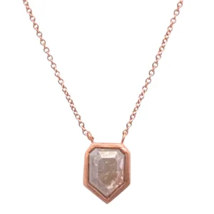 One rose gold solitaire-style necklace featuring a bullet-shaped salt and pepper diamond