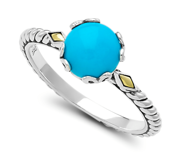 One sterling silver birthstone ring from the Glow series by Samuel B. with a center round cabochon Sleeping Beauty turquoise with a twisted band design and diamond-shaped solid 18 karat yellow gold accents in the shoulders