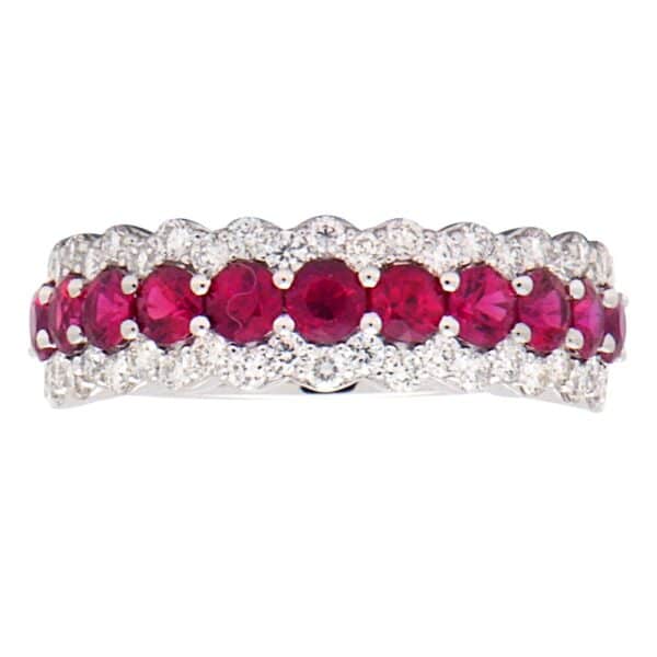 A white gold fashion band set with a center row of round-faceted rubies and two outer rows of smaller round-faceted diamonds