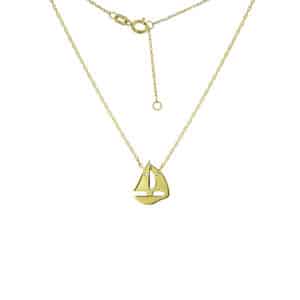 A yellow gold necklace with a mini sailboat charm pendant