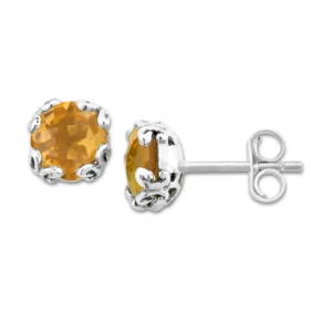 One pair of sterling silver stud earrings containing 2 round-shaped checkerboard-faceted citrines measuring 7mm each in ornate prong settings. Secured with friction posts and backs.