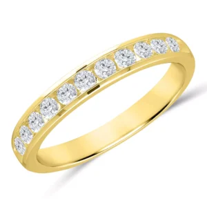 A yellow gold wedding-style band channel set with 11 round brilliant diamonds weighing a half carat