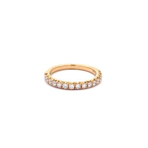 A yellow gold wedding-style straight band set with a half carat of round diamonds