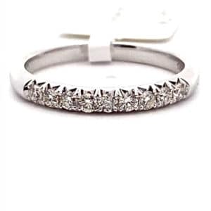 A white gold wedding band containing round diamonds weighing 0.23ctw
