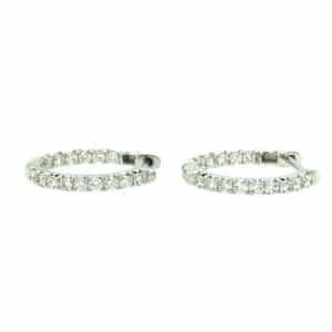One pair of white gold hoop earrings set with a half-carat of round diamonds