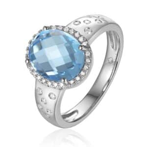 14 karat white gold statement ring with an oval shaped checkerboard-faceted blue topaz weighing 3.70 carats and 38 round brilliant diamonds set in the halo and in flush settings in the band