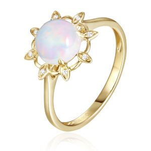 A yellow gold ring with a lotus blossom motif set with a center opal and diamond accents