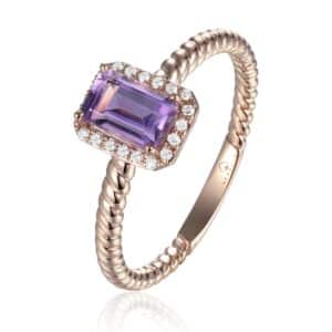 A 14 karat rose gold ring featuring an emerald-cut amethyst with a fitted diamond halo and a rope texture band