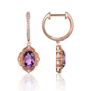 A pair of 14 karat rose gold Moroccan-inspired huggie hoop drop earrings with oval amethysts and diamond accents