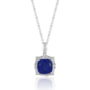 A white gold necklace featuring a cushion tanzanite with a vintage-inspired diamond halo