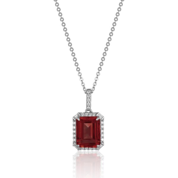 A white gold necklace with an emerald-cut garnet and diamonds in a halo and in the bail