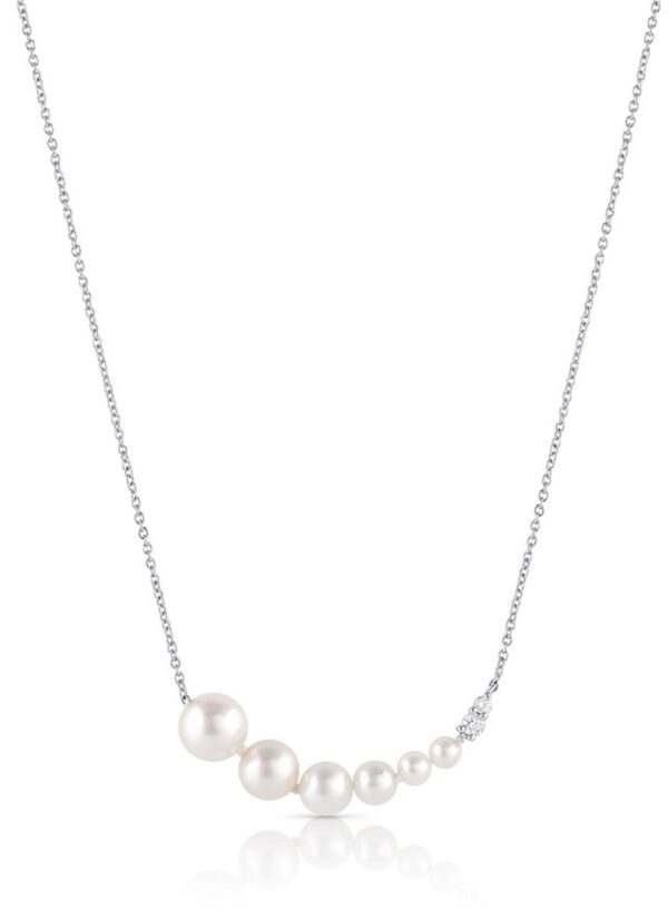 A white gold necklace with a fixed curved bar-style pendant of akoya pearls in graduated sizes