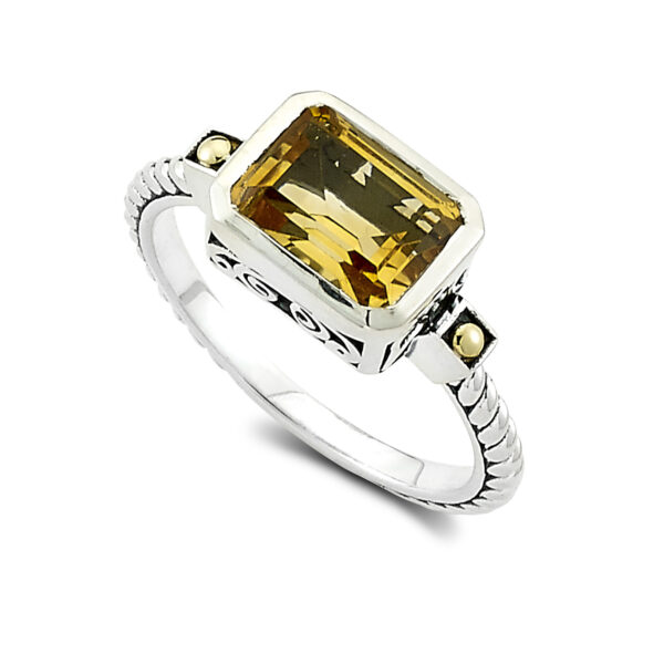 One sterling silver Eirini ring with solid 18 karat yellow gold accents and an emerald-shaped citrine