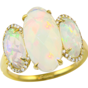 One 14 karat yellow gold three-stone ring by Bellarri with three oval-shaped faceted Ethiopian opals weighing 4.66 carats total weight with diamond halos around the outer two opals