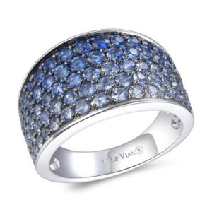 A 14 karat white gold wide tapered fashion band by Le Vian set with 83 round-faceted sapphires weighing 2.30 carats total weight in ombre shades ranging from dark blue to white in a gradient design in black rhodium-plated pave settings