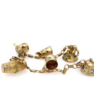 One estate vermeil charm bracelet accented with blue and green enamel designs