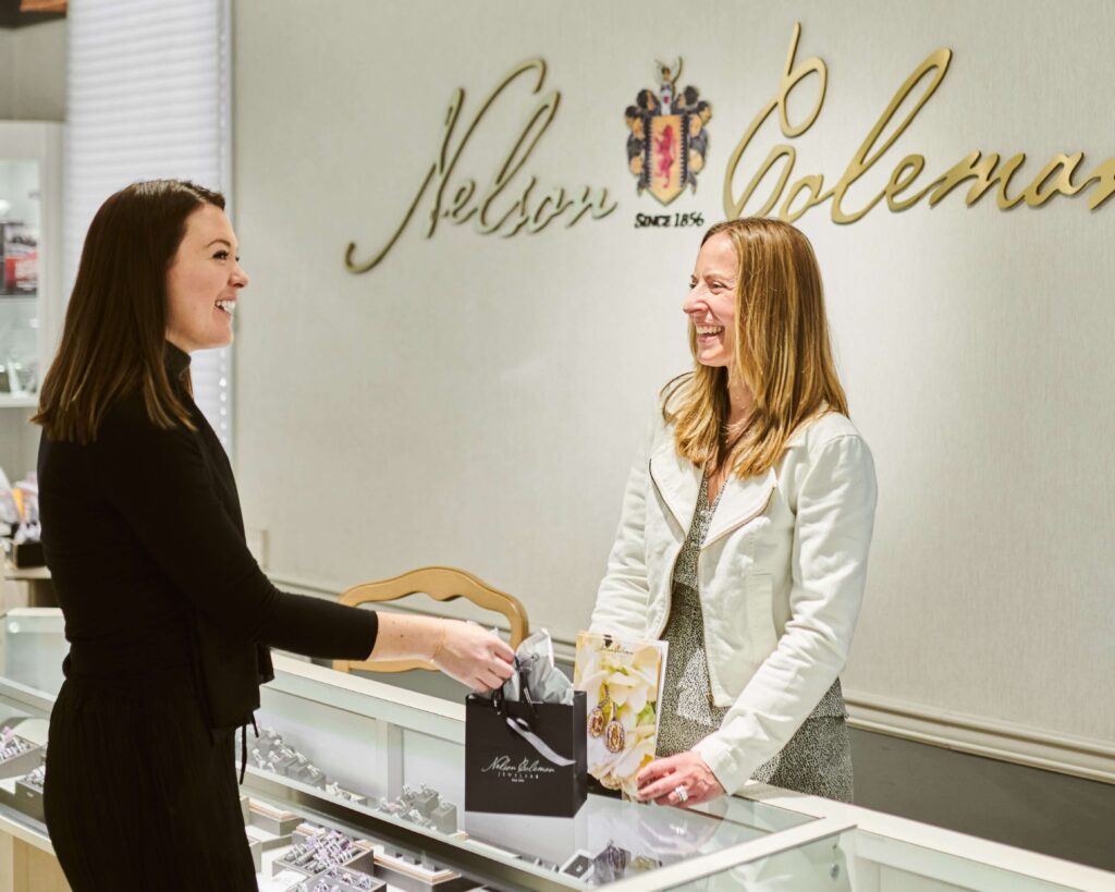Two women standing at the Nelson Coleman Jewelry Counter for a custom jewelry consultation