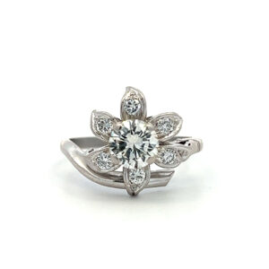 One estate vintage platinum floral motif ring with 1.32 carats of round brilliant diamonds