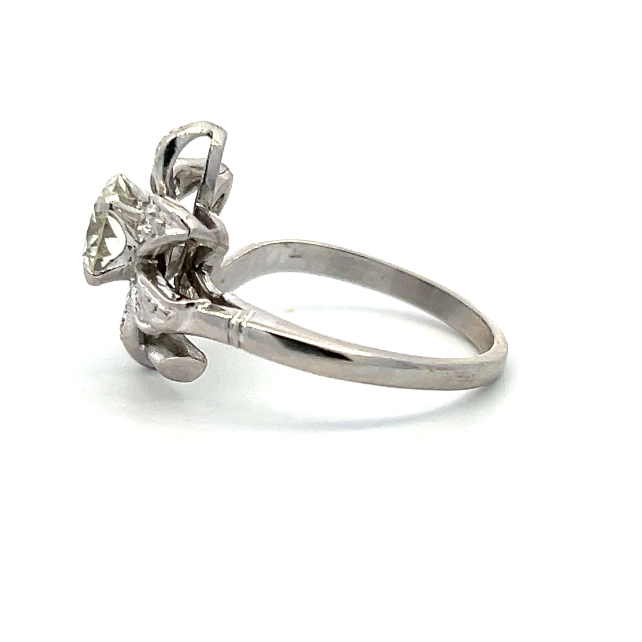 One estate vintage platinum floral motif ring with 1.32 carats of round brilliant diamonds