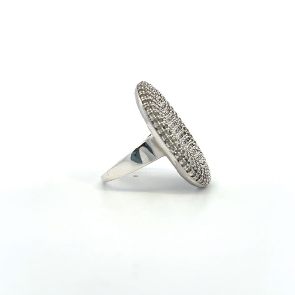 One estate sterling silver oval fashion ring with a cluster of round brilliant diamonds weighing 0.55 carat total weight