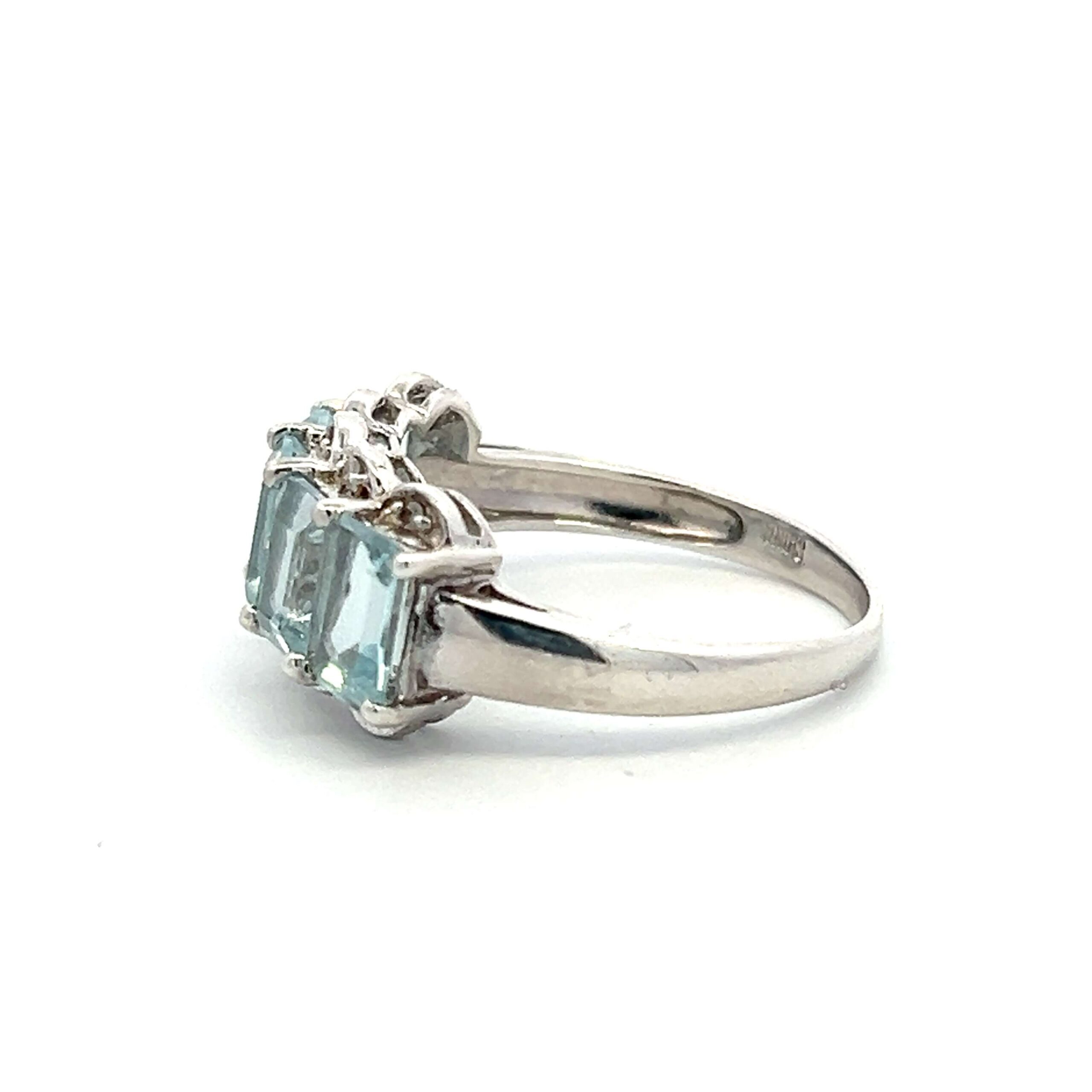 One estate sterling silver five-stone ring with 5 emerald-cut blue topazes and 10 round diamond accents
